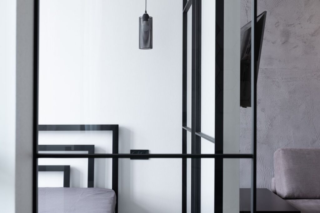pexels-photo-6436775-6436775 Hanging lamp in modern bedroom against room with TV set and glass wall in house